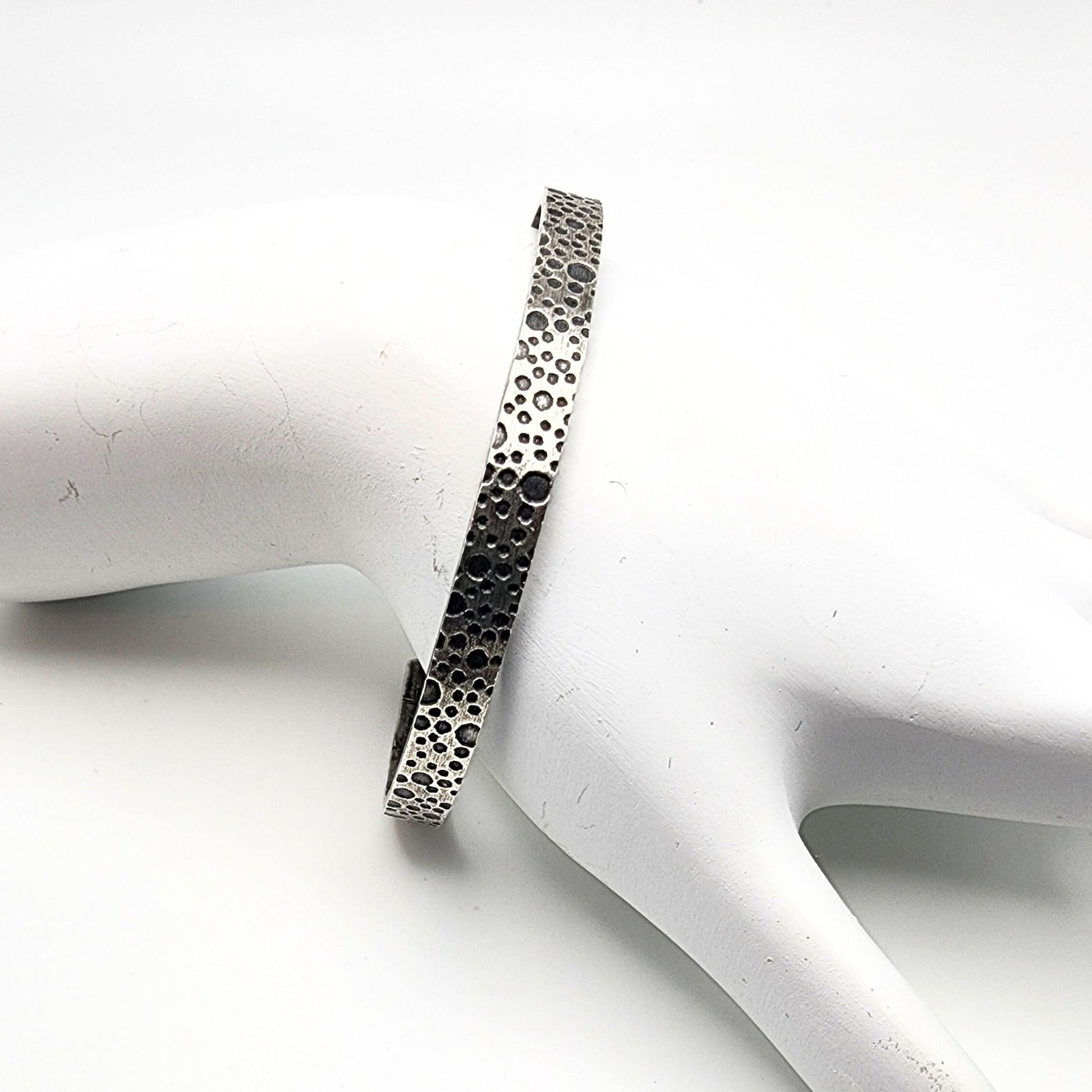 oxidized sterling silver bracelet with a water bubble texture