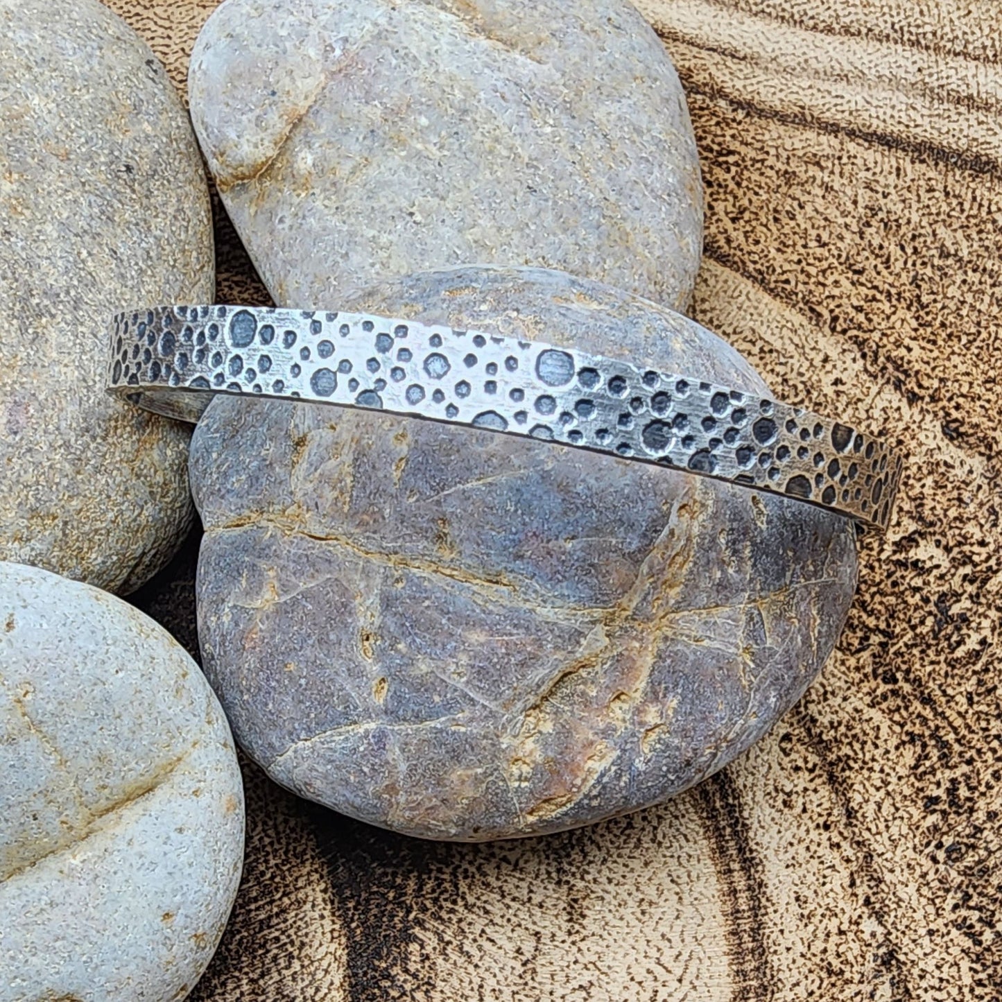 oxidized sterling silver bracelet with a water bubble texture