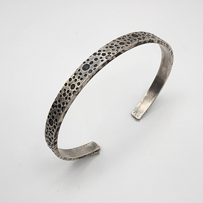 oxidized sterling silver bracelet with a water bubble texture
